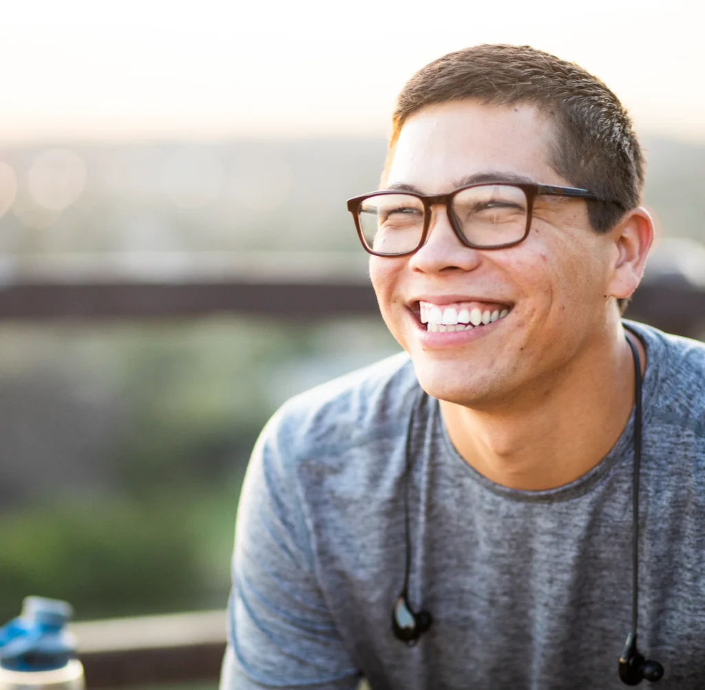 man wearing glasses smiling