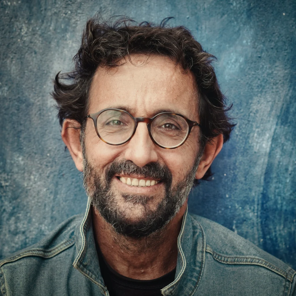 man smiling wearing glasses